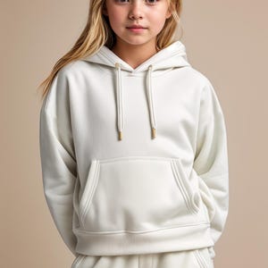 May include: A white hooded sweatshirt with a kangaroo pocket and a drawstring hood. The sweatshirt is made of a soft, comfortable fabric.