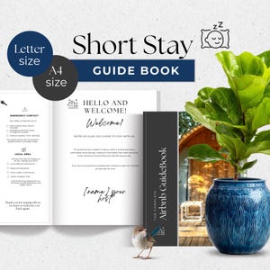 May include: A guide book titled "Short Stay GUIDE BOOK" with the text "HELLO AND WELCOME! Welcome!" and "Airbnb GuideBook." The book is open to a welcome page. A blue ceramic pot holds a green plant. A small bird stands near the book.