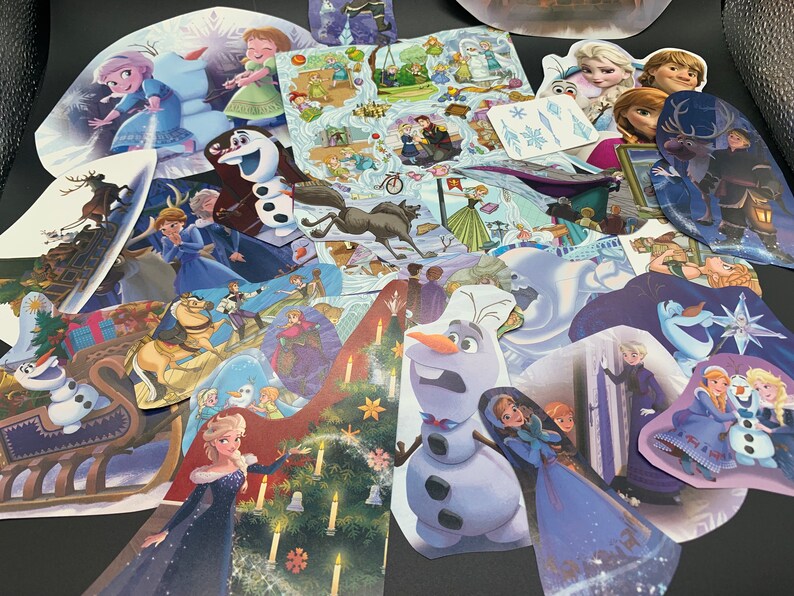 May include: A collection of colorful stickers featuring characters from the animated film Frozen. The stickers include images of Elsa, Anna, Olaf, Kristoff, Sven, and other characters from the movie. The stickers are perfect for decorating notebooks, laptops, water bottles, and other items.