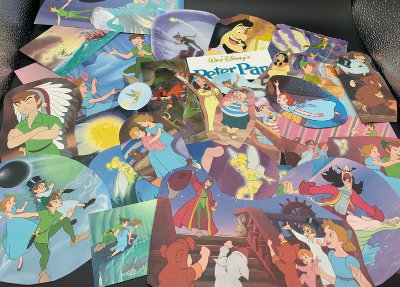 May include: A collection of colorful cartoon character illustrations from the Disney movie Peter Pan. The illustrations feature Peter Pan, Captain Hook, Tinkerbell, Wendy, and other characters from the movie. The illustrations are printed on cardstock and are perfect for scrapbooking, card making, or other craft projects.
