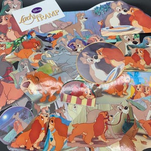 May include: A collection of Lady and the Tramp stickers featuring various scenes from the Disney movie. The stickers are colorful and feature the main characters, Lady and Tramp, as well as other supporting characters. The stickers are perfect for adding a touch of Disney magic to any project.