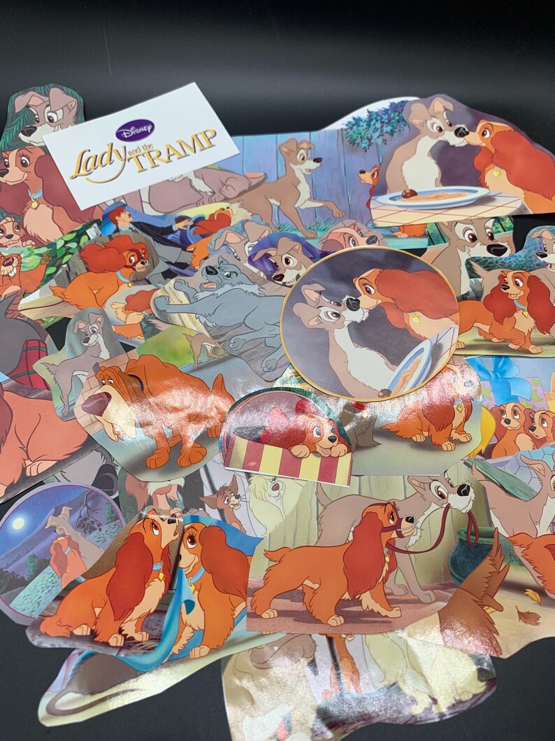 May include: A collection of Lady and the Tramp stickers featuring various scenes from the Disney movie. The stickers are colorful and feature the main characters, Lady and Tramp, as well as other supporting characters. The stickers are perfect for adding a touch of Disney magic to any project.
