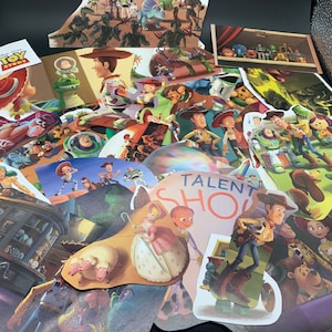 May include: A collection of colorful paper cutouts featuring characters from the Toy Story franchise. The cutouts include Woody, Buzz Lightyear, Jessie, and other characters from the movie. The cutouts are arranged in a random order and are all different sizes. The cutouts are on a black background.