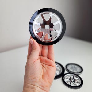 Black and silver acrylic racing car wheels | Cake topper decoration | Car themed cake | car wheels | silver wheels | racing car birthday
