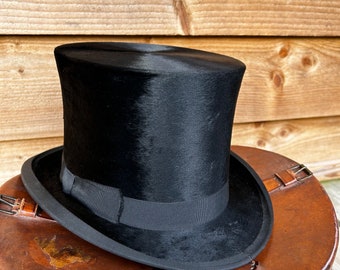 Antique black silk top hat by Woodrow & leather carry case with key size 7 dated 13 June 1924