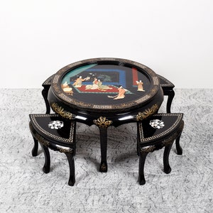 Chinese coffee table with 4 stools, in black lacquered wood, mother-of-pearl and semi-precious stone inlays. Glass top.