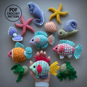 10-in-1 aquariumhaakpatronen pdf. 10-in-1 amigurumi met oceaandieren. Vis, mossel, zeester, slak, zeewier