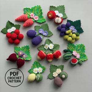 May include: A collection of crocheted fruit and vegetable appliques including carrots, apples, berries, grapes, aubergines, strawberries, watermelon, lemons, limes, and kiwis, each with green leaves and small flowers, plus a PDF CROCHET PATTERN label.