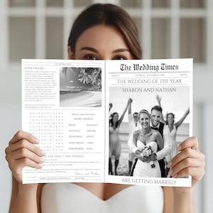 May include: A black and white wedding newspaper held by a person. The headline reads "The Wedding Times" with the names "Sharon and Nathan" and the phrase "Are Getting Married!". The newspaper includes a photo of the couple and a word search.