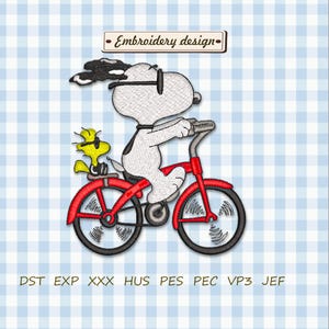 May include: An embroidery design featuring Snoopy riding a red bicycle with Woodstock on the back. The design includes the text "Embroidery design" in a banner at the top. The background is a light blue gingham pattern.