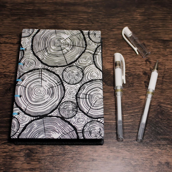 Black Paper Sketchbook in Trippy Log Dimes and Denim. Handmade coptic stitch lay flat book for gel pens or white pencil drawing. Acid free.