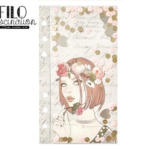 May include: A pink and gold floral patterned planner with a drawing of a woman with a floral crown and sequins on the cover. The planner has the text "FILO fascination" on the cover.