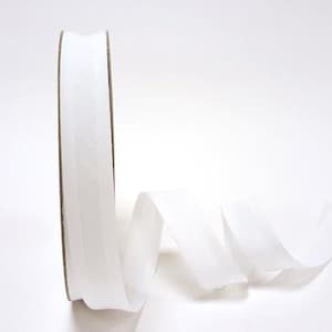 May include: White cotton bias binding, a type of fabric trim used for finishing seams and edges.