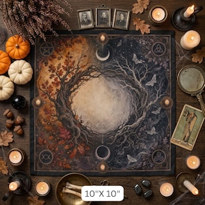 May include: A square altar cloth measuring 10 inches by 10 inches, featuring a circular design of a tree transitioning from autumn leaves to bare winter branches, with moon phases, moths, and symbols in the corners on a dark background.