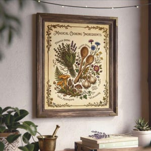 May include: Framed print featuring the words "Magical Cooking Ingredients." The illustration includes foraged herbs, wooden spoons, wild mushrooms, aged garlic, and wildflowers. The frame is brown with brass corner accents.