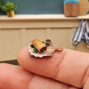 May include: A rustic wooden sign with the text "Welcome to our home" in white lettering. The sign features a distressed finish and a simple, inviting design, perfect for entryway decor.