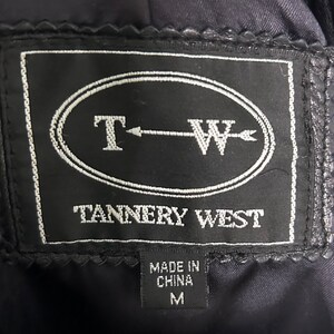 May include: Black leather jacket with a black label that says "T-W Tannery West" and "Made in China" with a size "M" tag.
