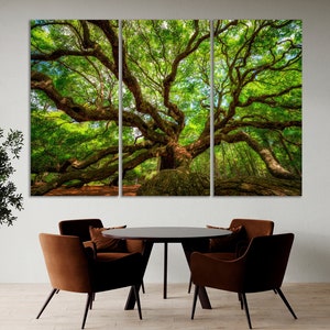 a dining room table with chairs and a large tree