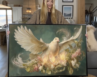 May include: A framed canvas art print featuring a white dove with outstretched wings, surrounded by soft, glowing flowers and foliage. The artwork has a teal and cream color palette, creating a serene and elegant aesthetic.