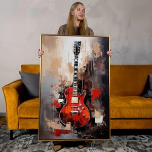 a painting of a guitar hangs in a hallway