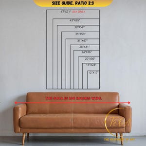 a living room with a couch and a painting on the wall