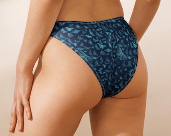 Turquoise Moths V-Cut Bikini Bottom with Navy Blue Background