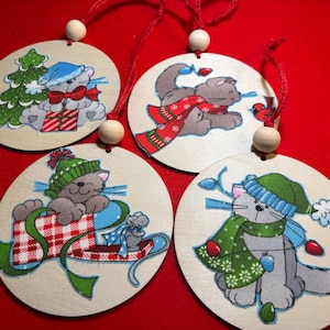 Cute grey kitty Christmas ornaments. Fabric Christmas kittens adorn both sides of these 4 inch ornaments.  Great gift for kids, cat lovers.