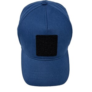 Blue cotton 5 panel hat with interchangeable patch panel, lightweight and adjustable design.