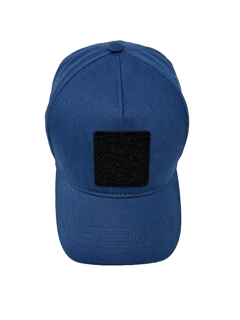 Blue cotton 5 panel hat with interchangeable patch panel, lightweight and adjustable design.