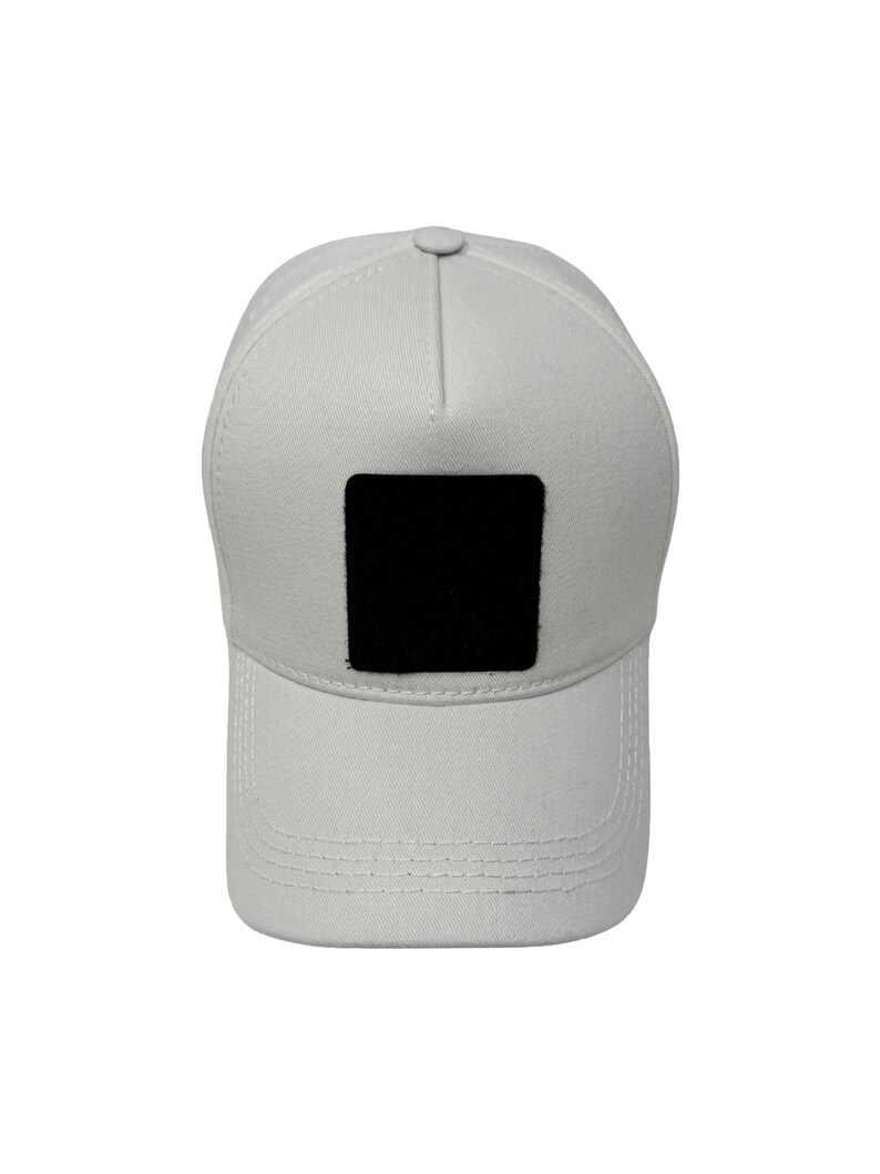 White 5 panel cotton hat with interchangeable patch front, clean minimalist look and adjustable fit.