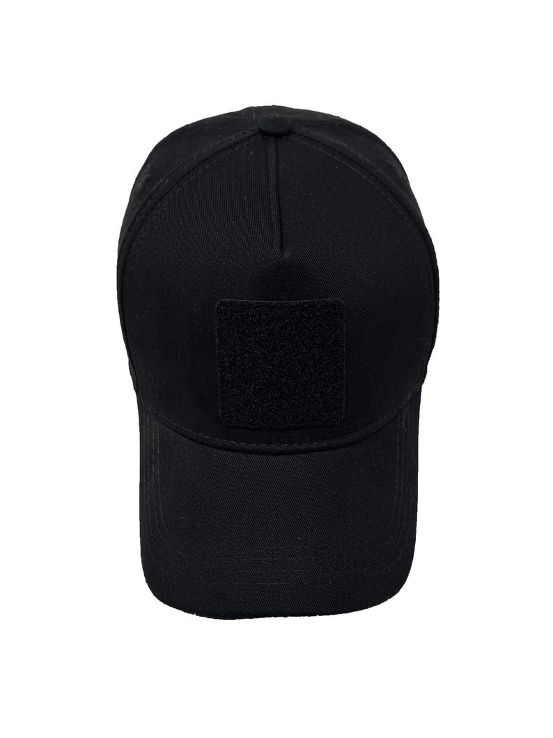 Black 5 panel cotton hat with hook and loop front patch panel, breathable and adjustable fit.
