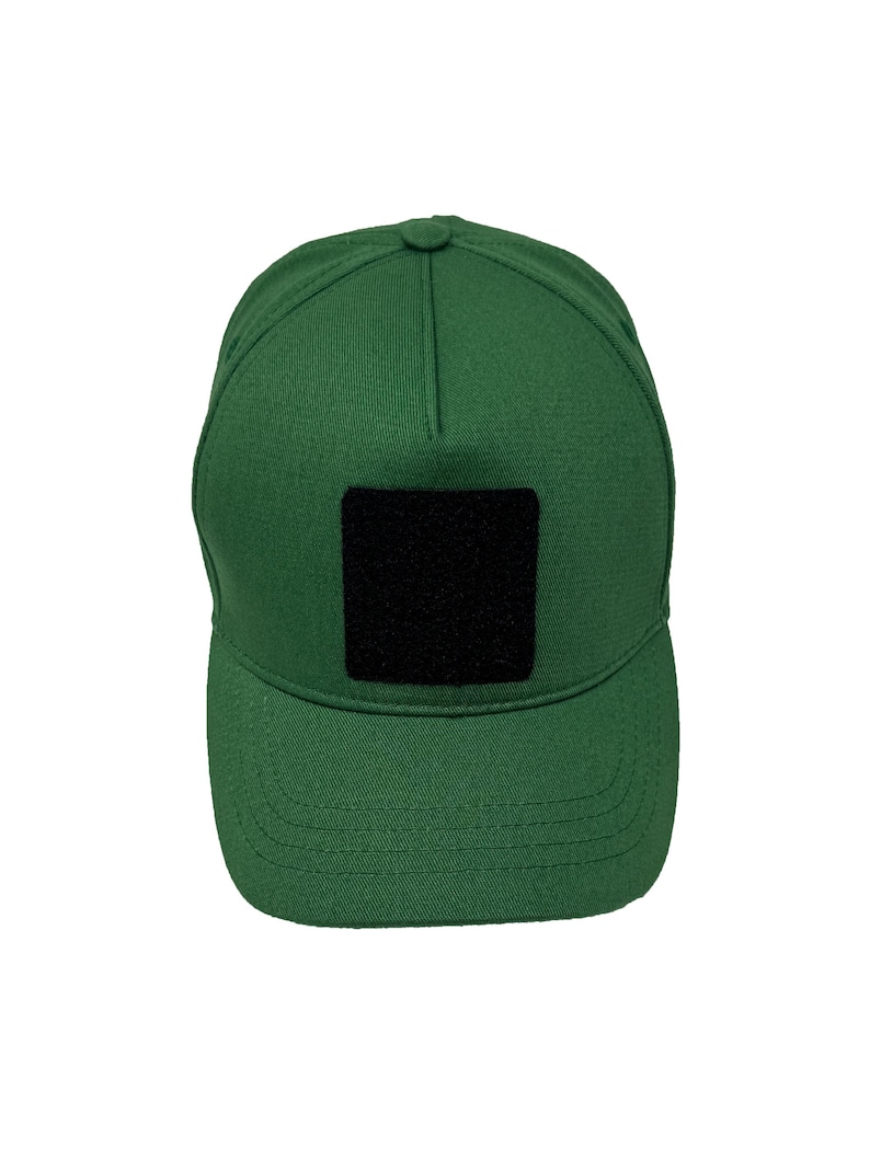 Green cotton 5 panel hat with removable patch panel, adjustable strap and comfortable fit.