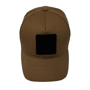 Caramel brown cotton 5 panel hat with Velcro patch front, breathable structured design.