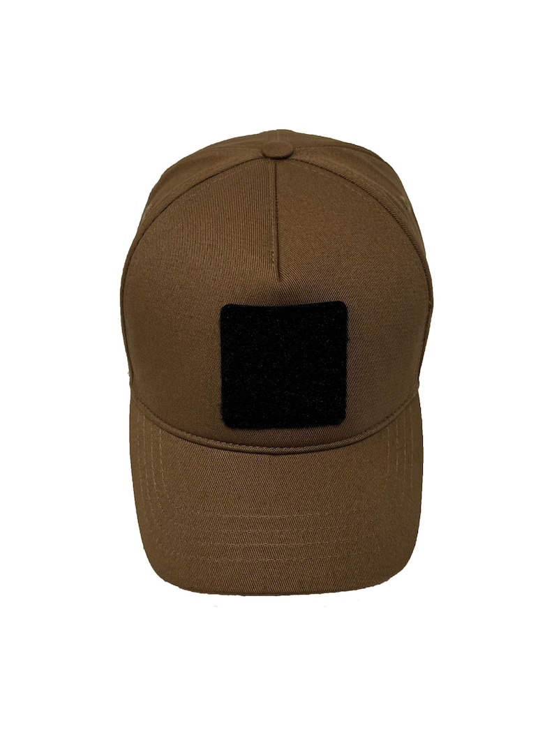 Caramel brown cotton 5 panel hat with Velcro patch front, breathable structured design.
