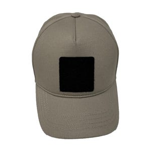 Beige cotton 5 panel hat with hook and loop patch panel, soft and adjustable for everyday wear.