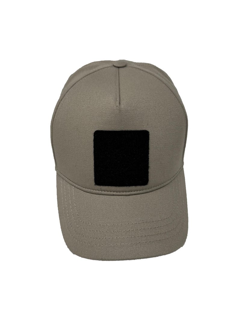 Beige cotton 5 panel hat with hook and loop patch panel, soft and adjustable for everyday wear.