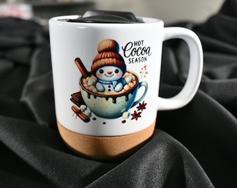 Mug with lid and cork base, snowman design on both sides