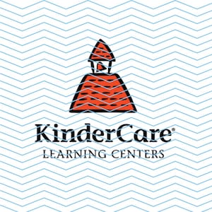 May include: A red and white schoolhouse logo with the text "KinderCare LEARNING CENTERS" below it. The logo is on a white background with a blue and white chevron pattern.