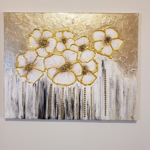May include: Abstract painting featuring white flowers with gold accents on a gold background. The flowers are arranged in a cluster and have a textured appearance. The background is a textured gold with a white and black striped pattern at the bottom.