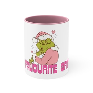 Su taza Grinch favorita