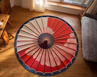 May include: A red and white Japanese-style umbrella with a blue border and a swirling cloud pattern. The umbrella is lying flat on a wooden floor.