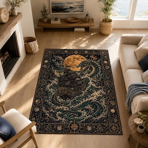 May include: A rectangular area rug featuring a dark, detailed illustration of a sailing ship caught in turbulent, swirling teal and blue ocean waves with a large, glowing golden moon above and a sea serpent encircling the vessel, framed by a nautical border.