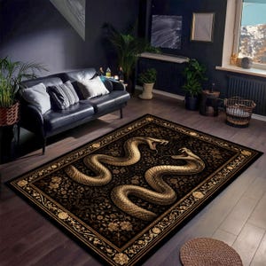 May include: A rectangular rug featuring a black backdrop with a gold floral design. Two large, gold snakes are the central element. The rug has a decorative border and is placed on a dark wooden floor.