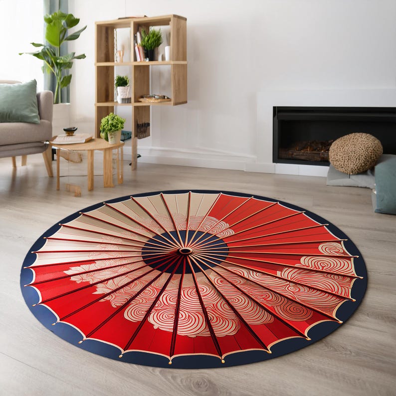 May include: A round red and white area rug with a blue border. The rug features a design of a Japanese umbrella with a swirling pattern.