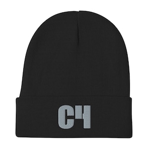 May include: Black knit beanie with a gray C4 logo embroidered on the front.