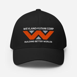 May include: Black baseball cap with the Weyland-Yutani Corp logo embroidered in white, orange, and gray. The logo features a stylized 'W' and the text "BUILDING BETTER WORLDS". A classic, structured fit.