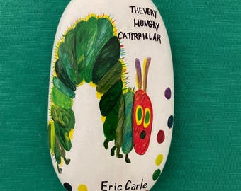 The Very Hungry  Caterpillar on a river rock