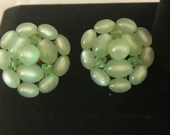 Green Moonglow clip-on earrings. 1940&quot;s? The earrings feature smaller oval and round beads and faceted spacers. Slightly over an inch.BOHO