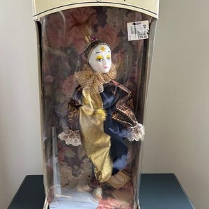New In Box Porcelain ANIMATED Harlequin Musical Jester Clown Limited Edition 16&quot;New old stock 1993.Comes w/stand in the box w/orig.tag.