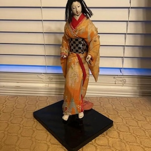Vintage Japanese Geisha Girl porcelain doll figurine on base. 12.5&quot; tall